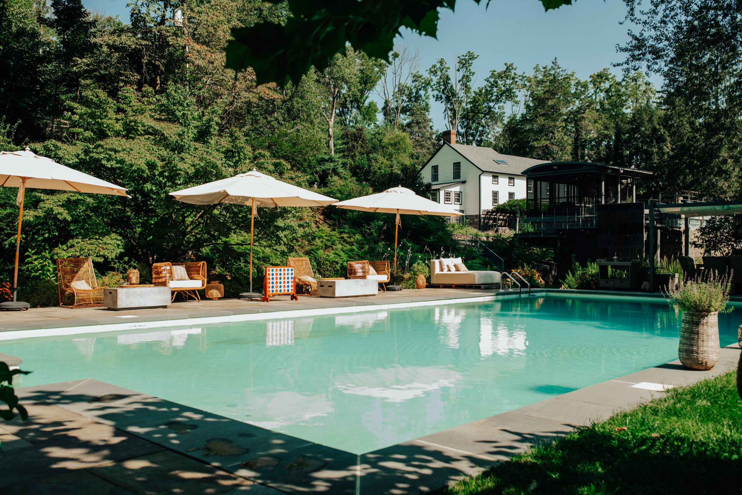 The pool and cabana with the 1819 farmhouse presiding above