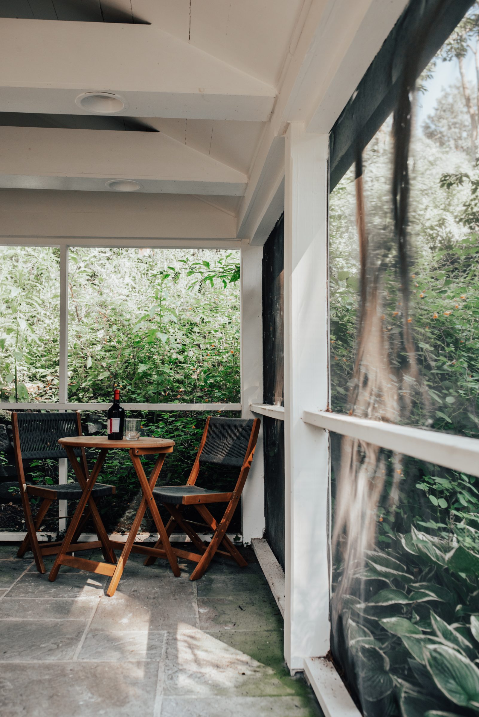 The screened porch with bistro seating